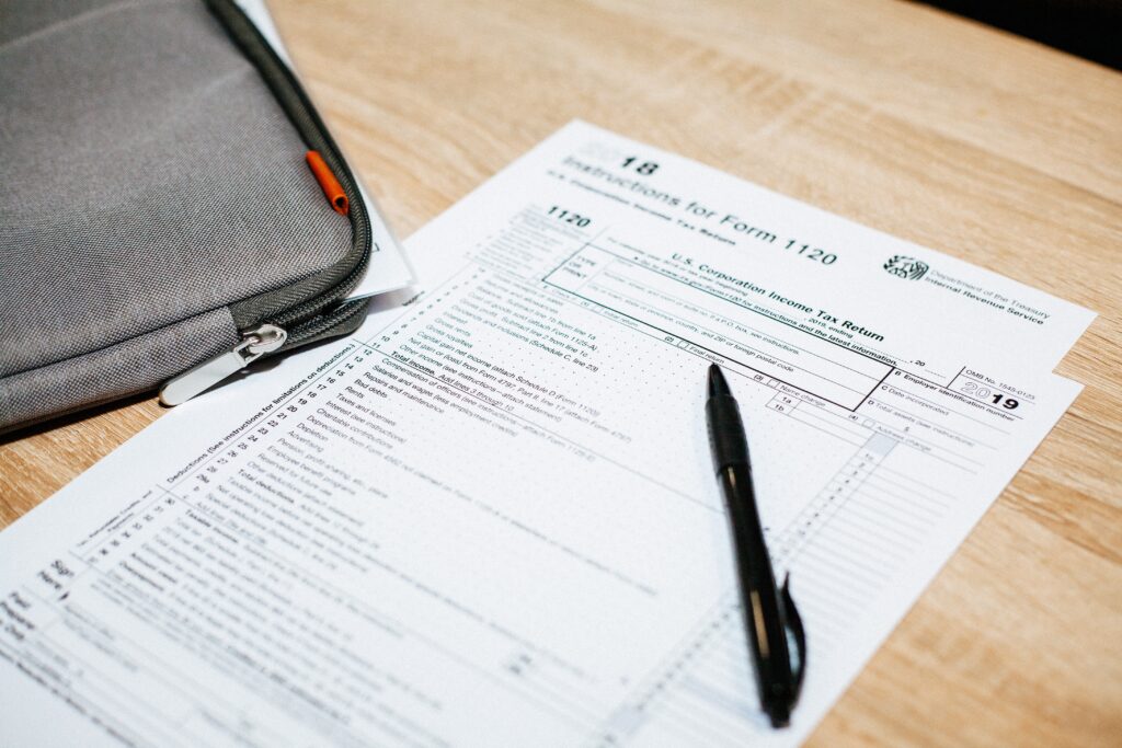 tax documents on table with pen