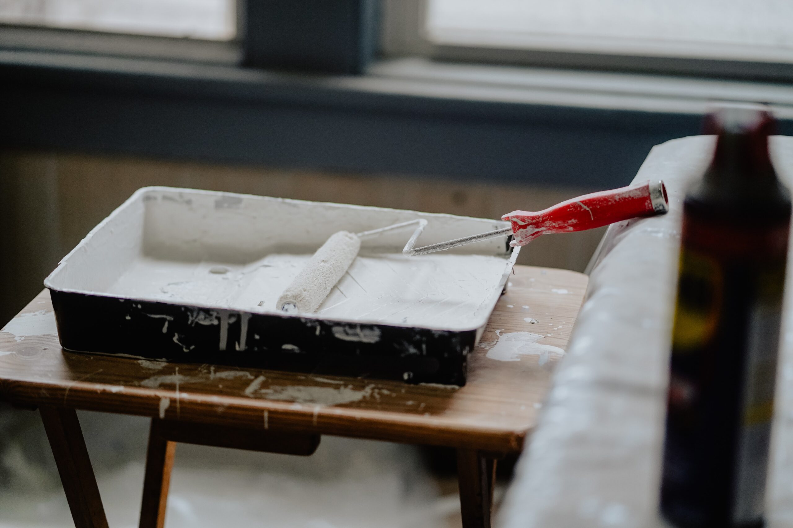Paint roller sitting in paint tray